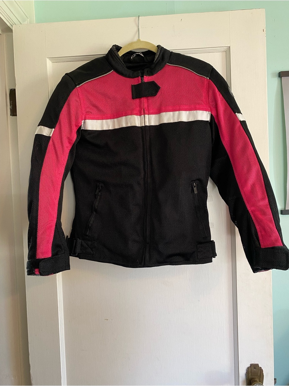 Women's Black/Pink Motorcycle Riding Jacket. Includes shoulder/elbow protection.
